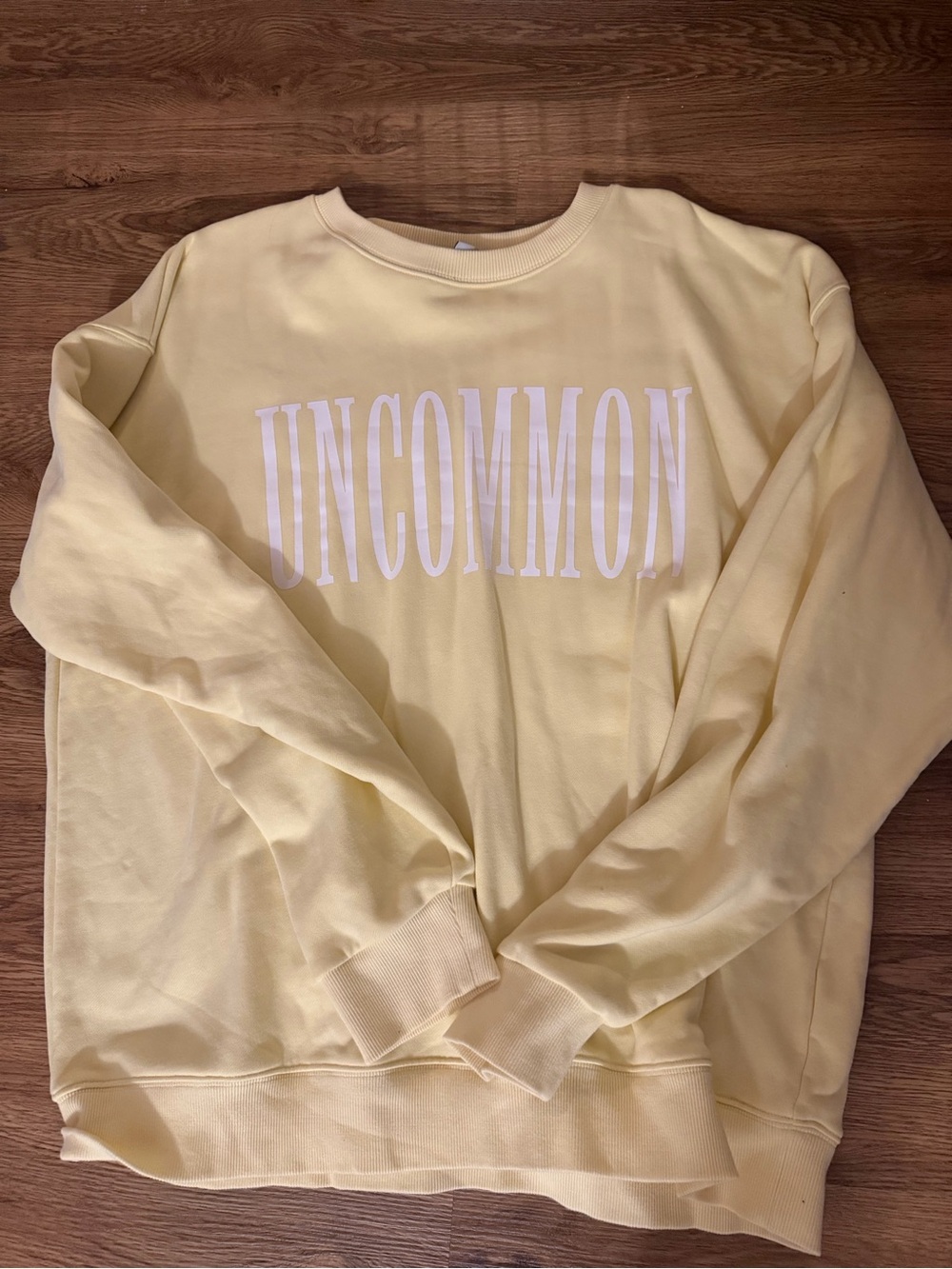 Uncommon James Women's Crewneck Sweatshirt in Pale Yellow with White Logo